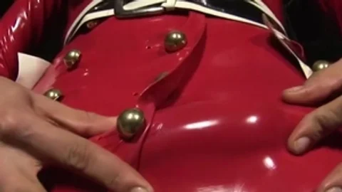 blonde lady-man In Red Latex costume Plays With Her biggest milk shakes And Jerks Off